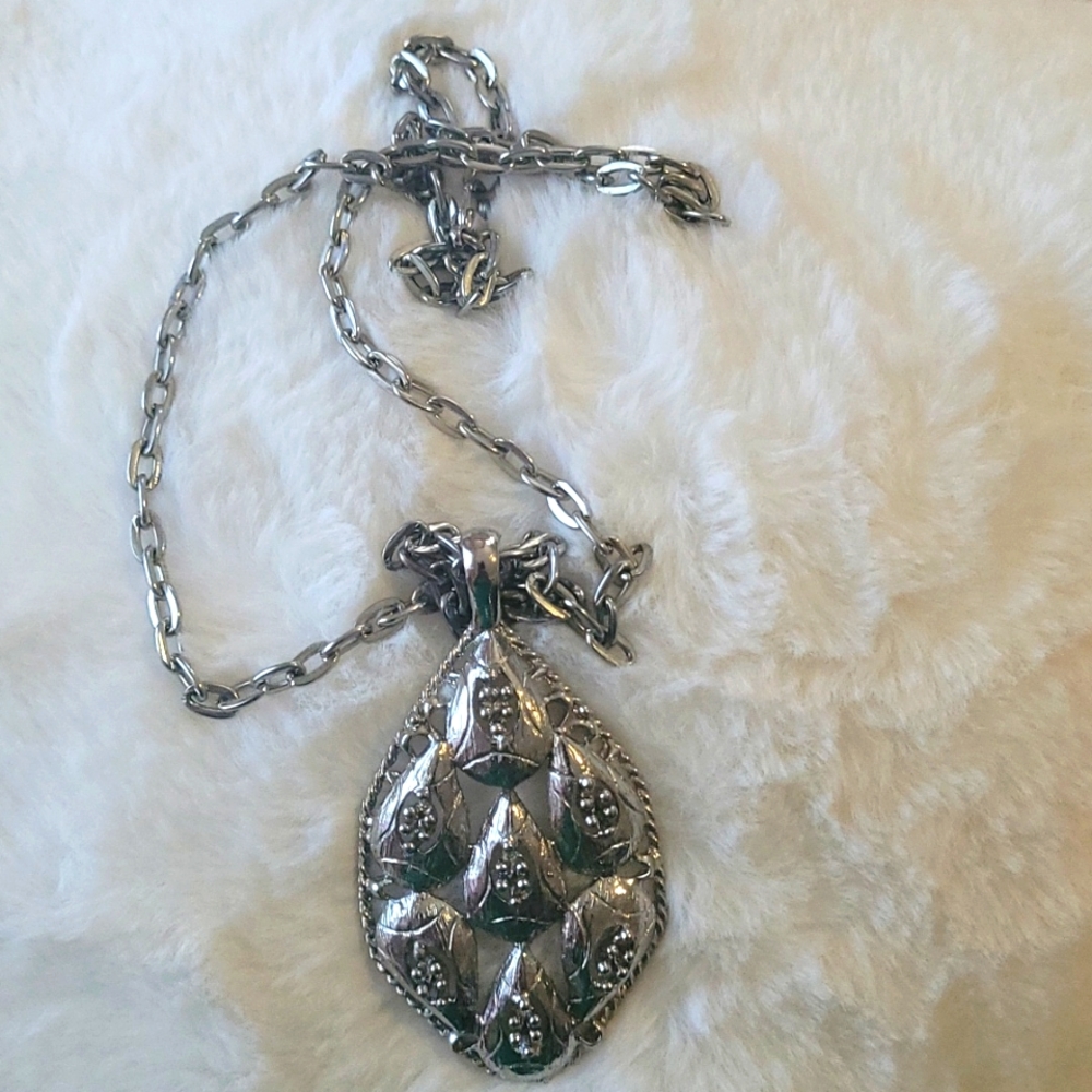 Necklace with pendant.